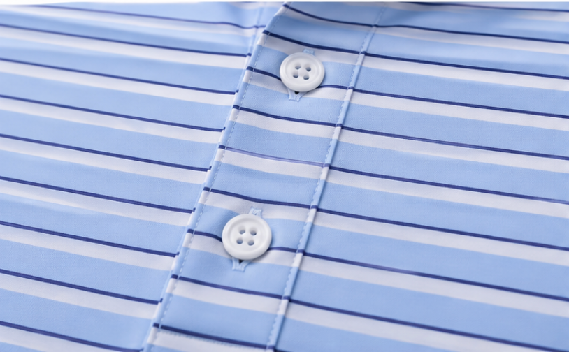 Closeup picture of the Blue Line polo placket. Blue, navy, white stripe with white buttons.