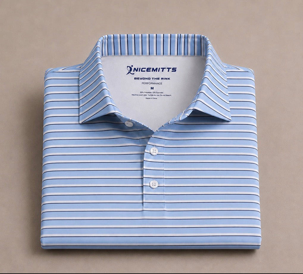 A folded light blue and white striped polo with a pointed collar and three-button placket, displayed on a neutral beige background. The brand name 'NICEMITTS' is visible on the inner neck label.